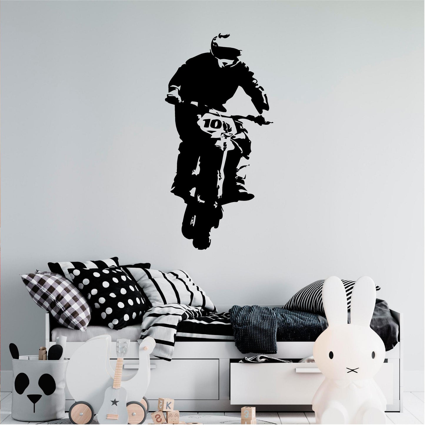 Black rally biker wall decal above a child's bed