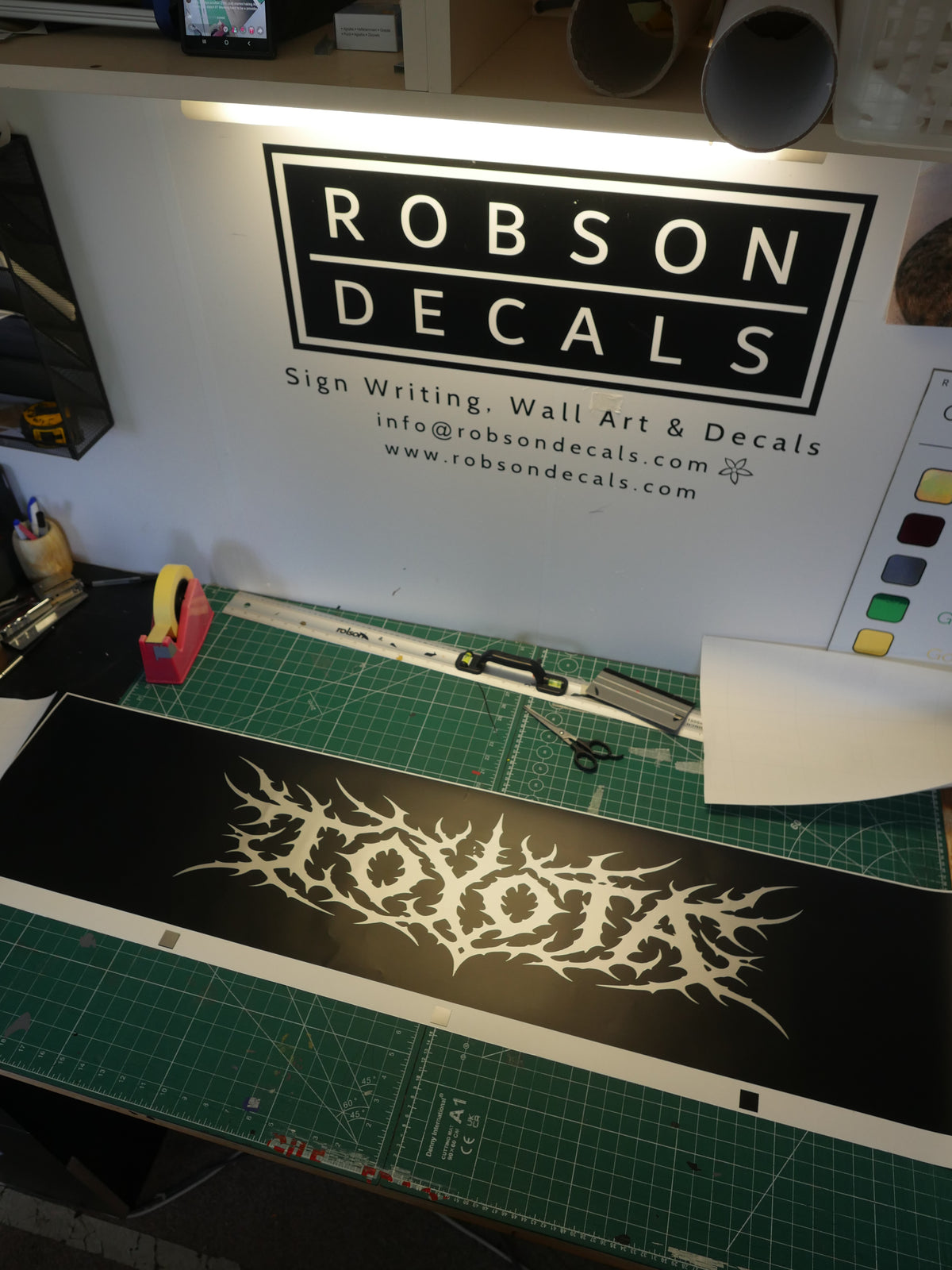 Spiked lettering logo — prepared vinyl lettering or artwork, workshop photograph