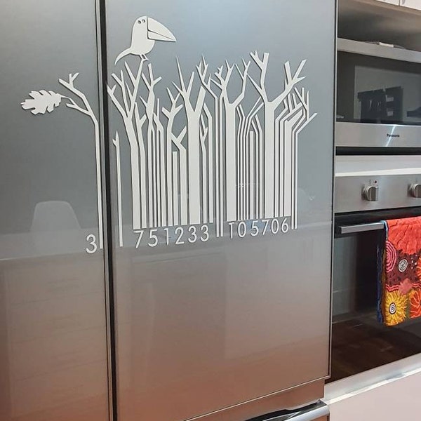White bird and barcode-style tree design on a silver fridge.