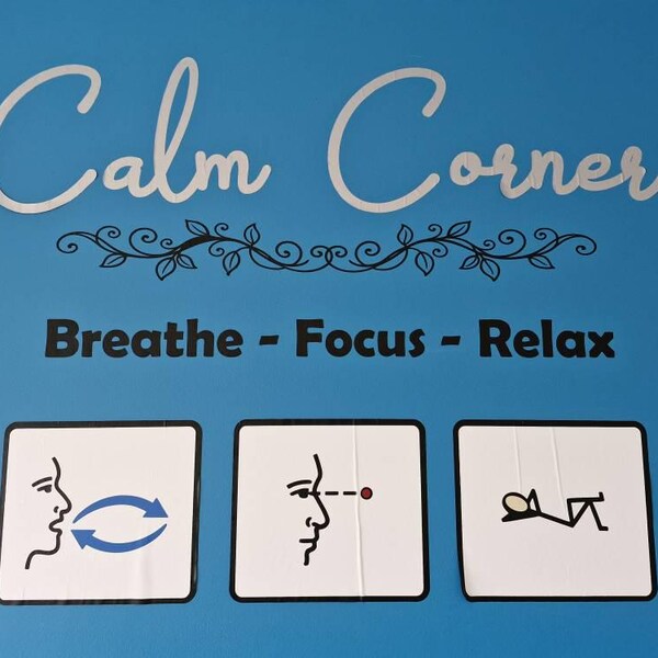Calm Corner and Breathe Focus Relax lettering on a blue wall.