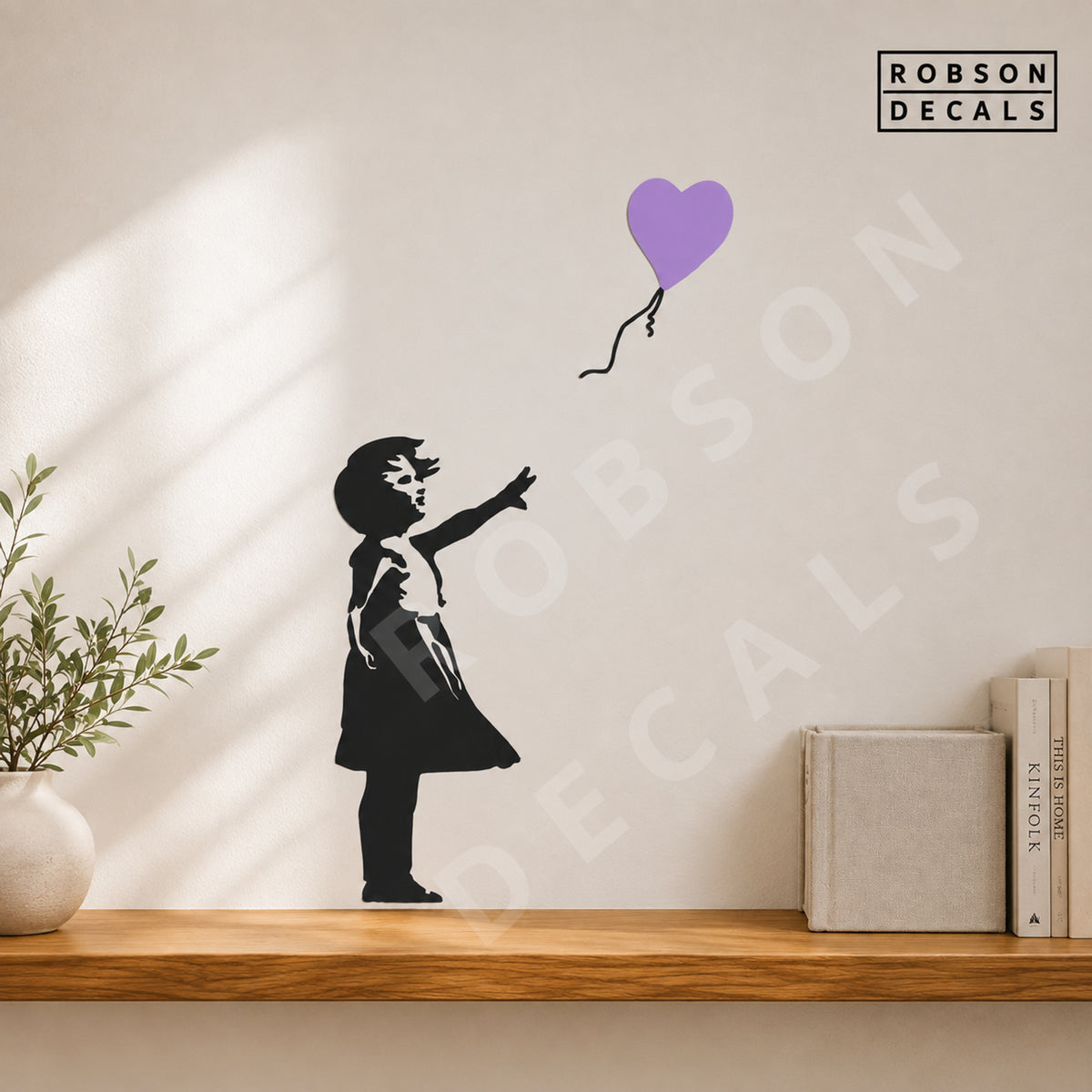 Balloon Girl wall decal with a lavender heart balloon above an oak ledge, shown as pictured. Robson Decals logo and watermark.