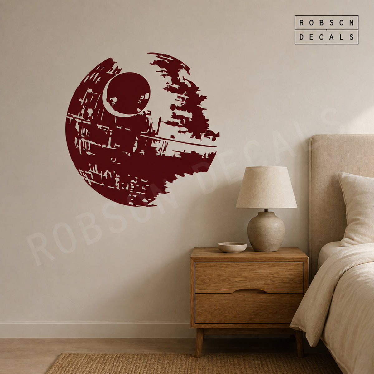 Burgundy Death Star wall decal beside an oak bedside cabinet, as pictured. Robson Decals logo and watermark.
