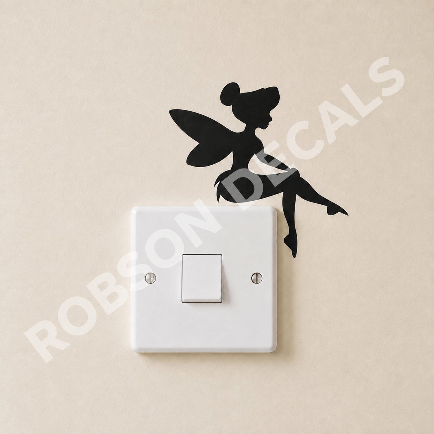 Black Little Fairy decal above a white light switch on an ivory wall, with Robson Decals watermark.