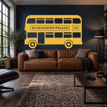Golden yellow single-colour London bus wall decal, including matching wheels, in a media lounge. Buckingham Palace route 10.