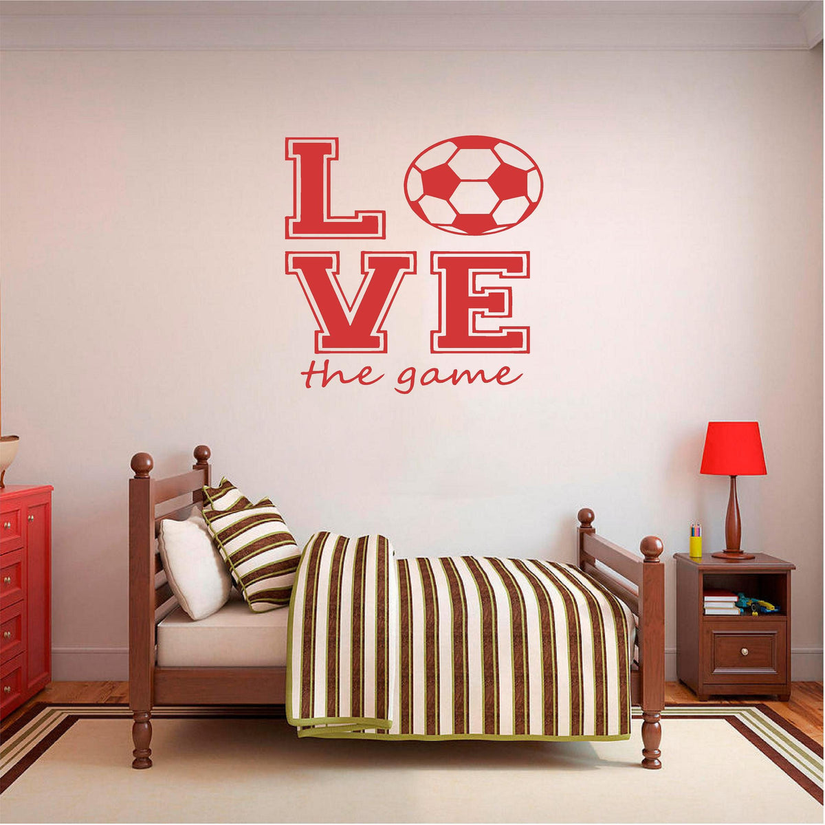Red Love the Game football wall decal above a wooden single bed.