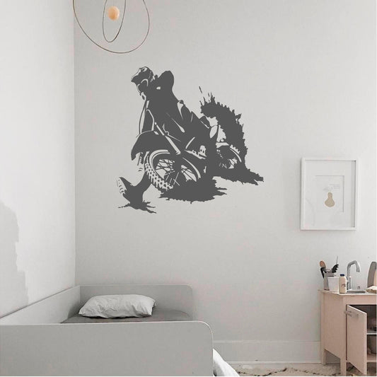 Grey motocross rally rider wall decal above a grey child's bed