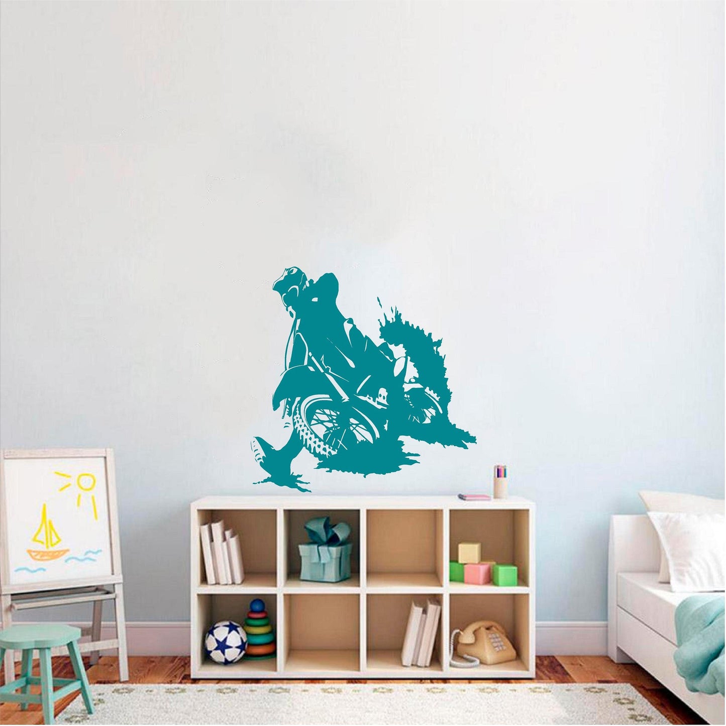 Teal motocross rally rider wall decal above a cube shelf