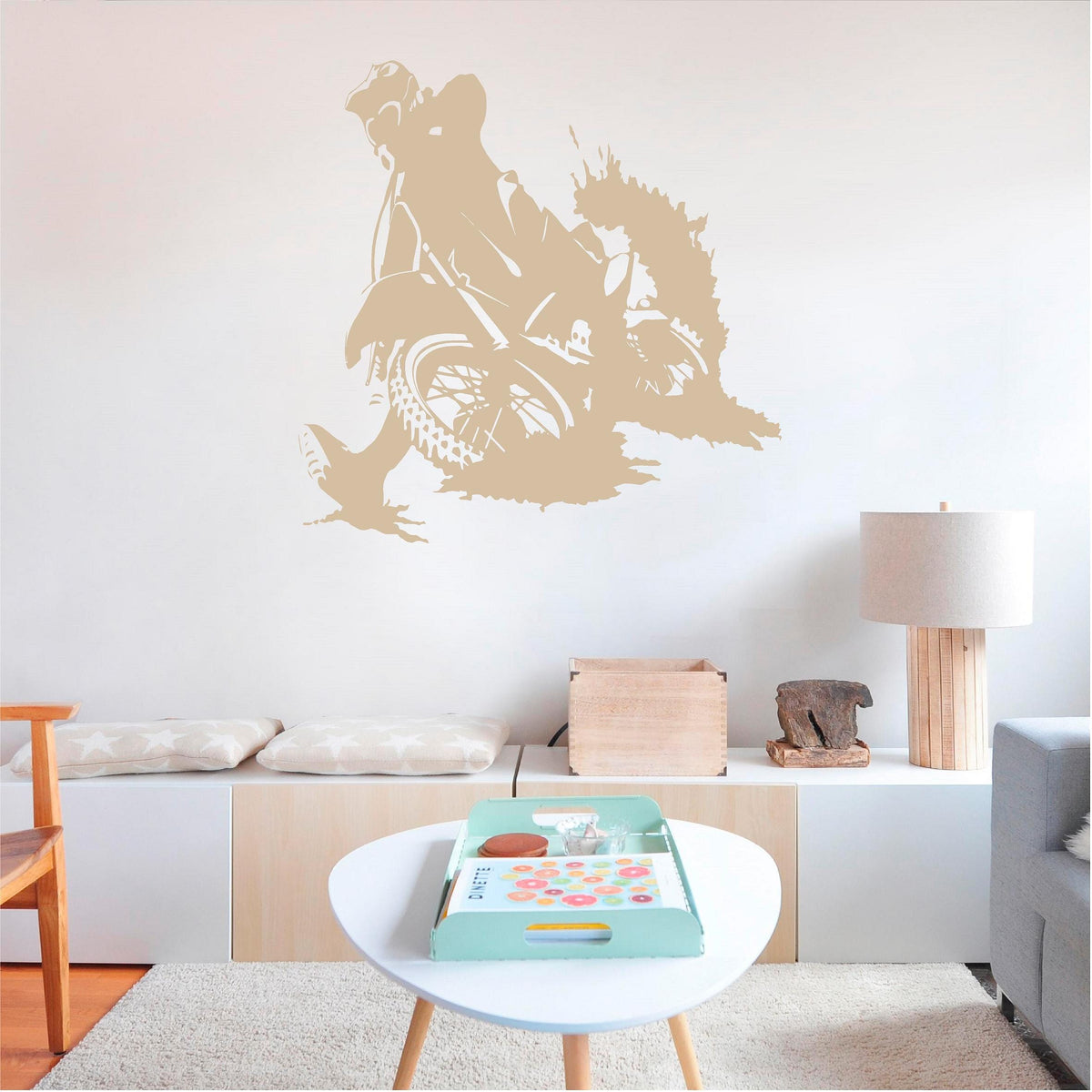 Beige motocross rally rider wall decal above a low cabinet