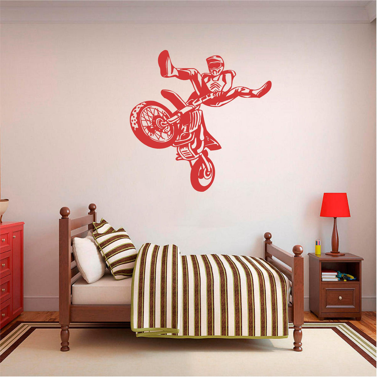 Red freestyle motocross rider wall decal above a wooden bed