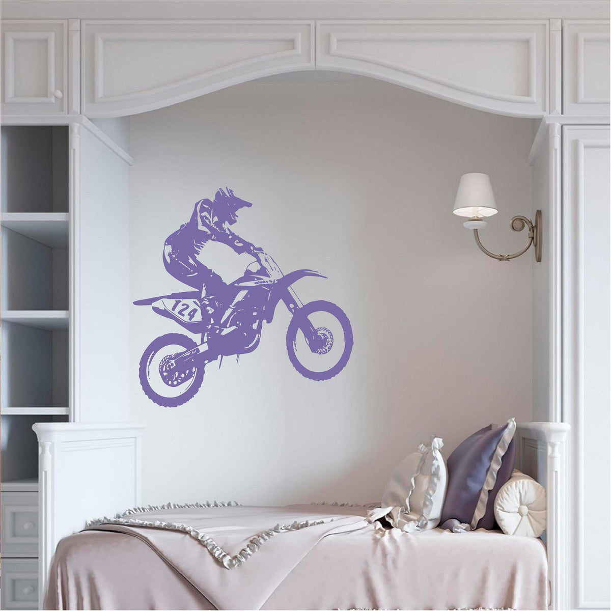 Purple motocross rider wall decal above a bed in a panelled bedroom