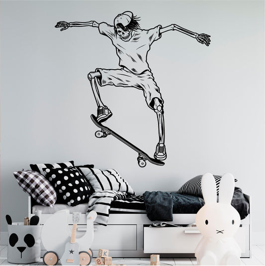 Black skeleton skateboarder wall decal with a backwards cap, shorts and trainers above a child's bed.