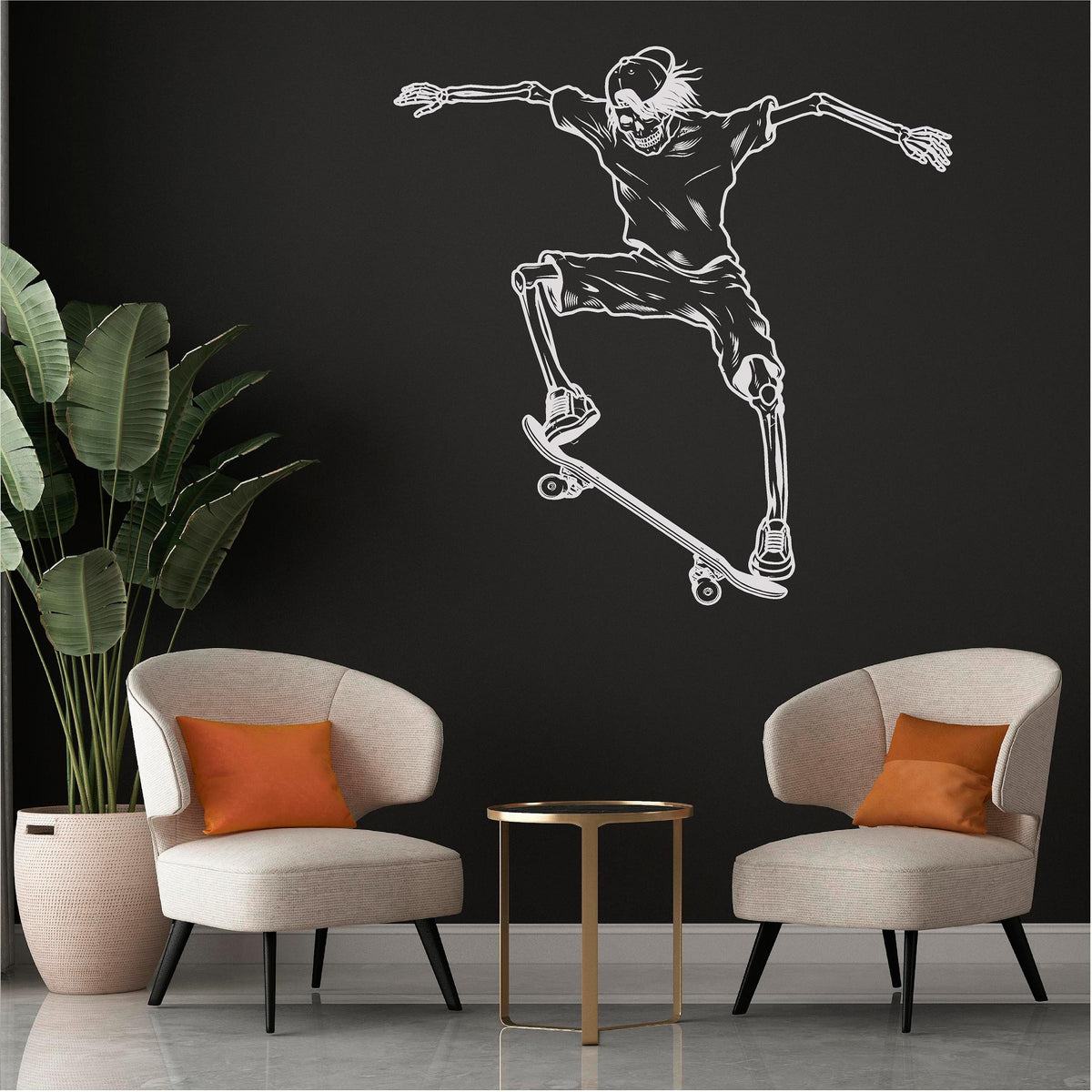 White skeleton skateboarder wall decal on a black wall above two chairs.