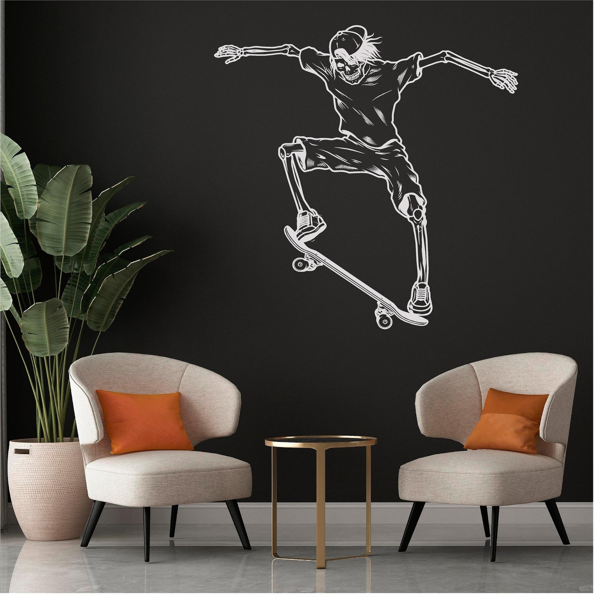 White skeleton skateboarder wall decal on a black wall above two chairs.