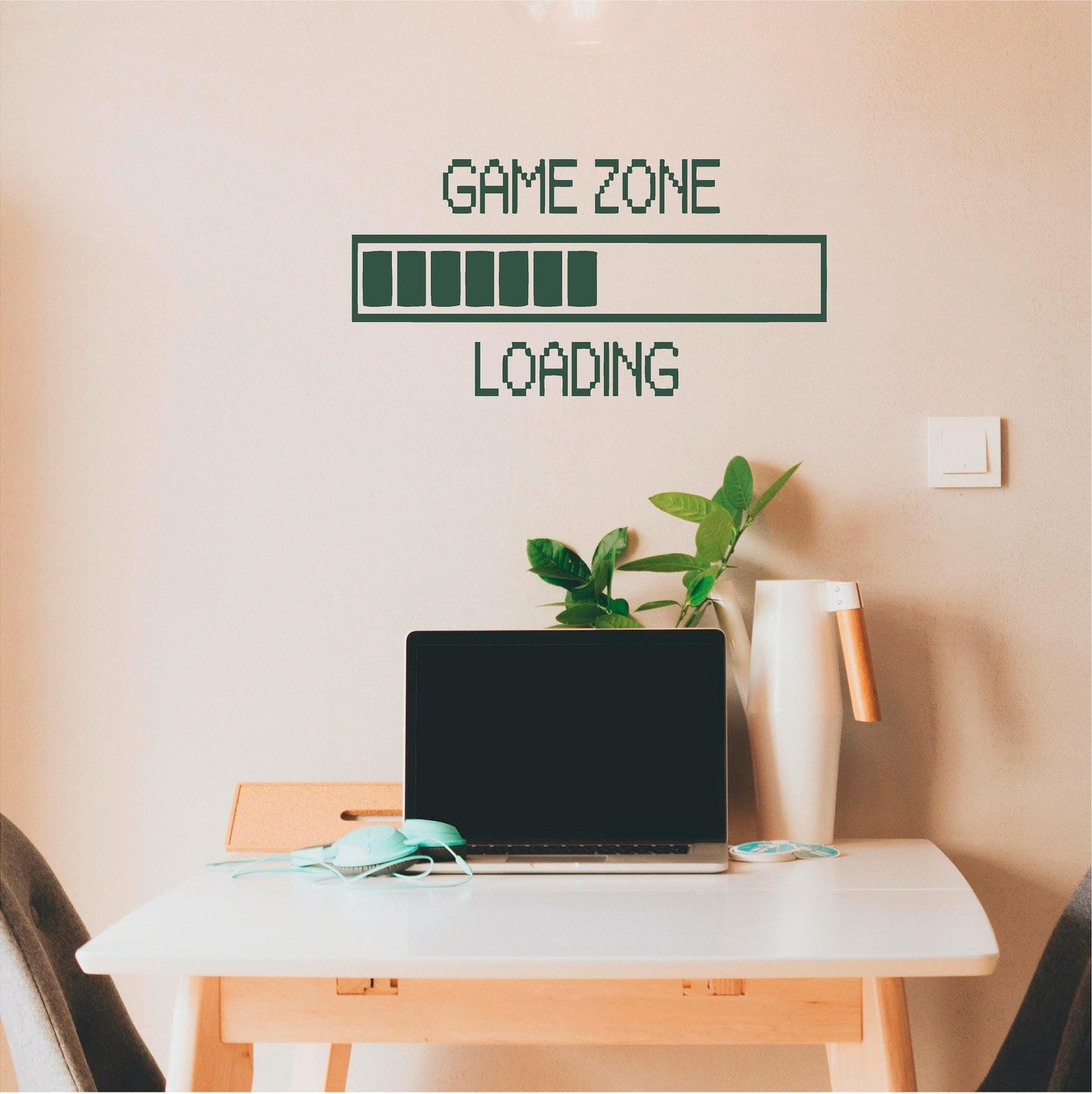 Dark green Game Zone Loading wall decal above a laptop desk