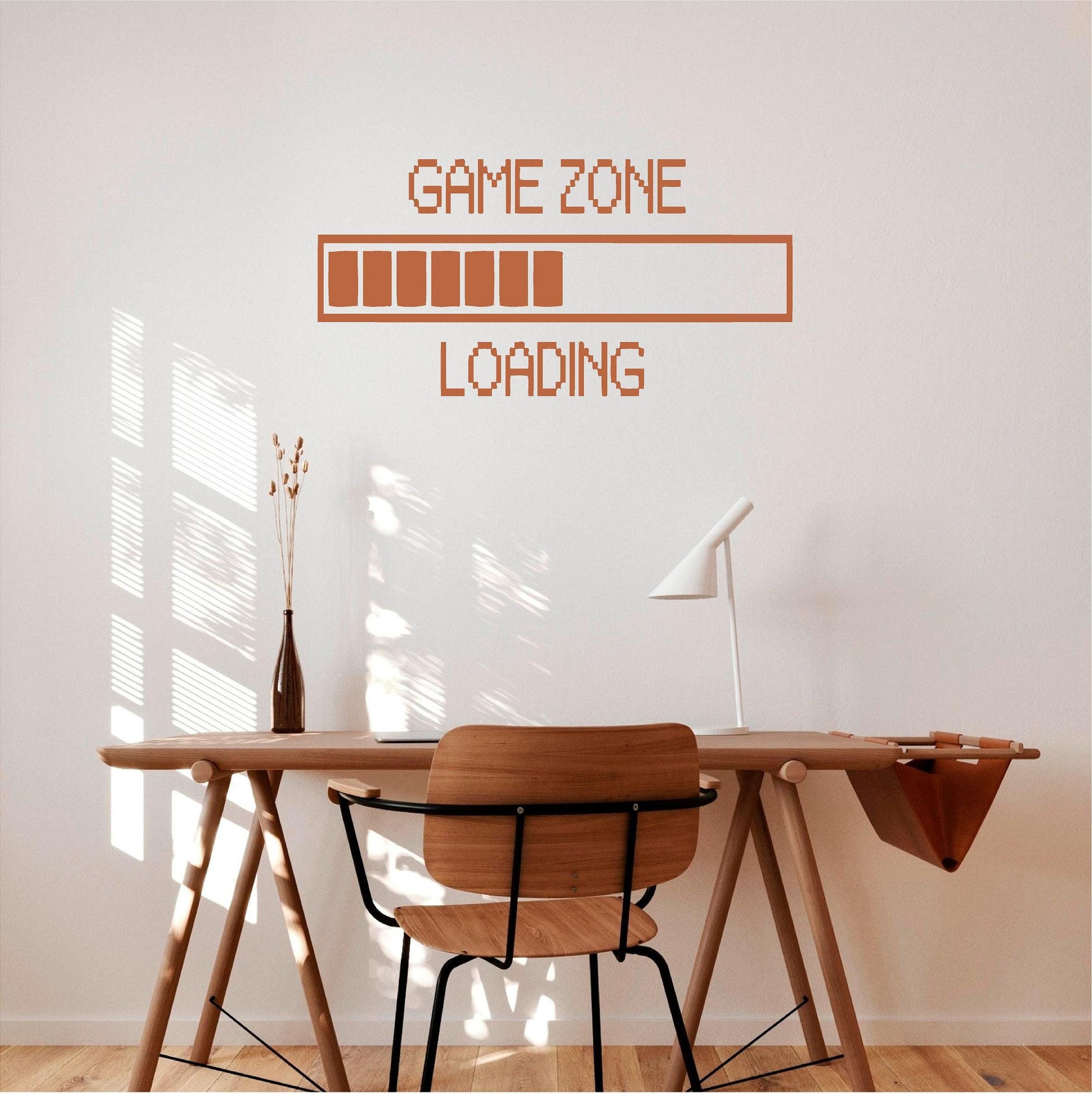 Brown Game Zone Loading wall decal above a wooden desk