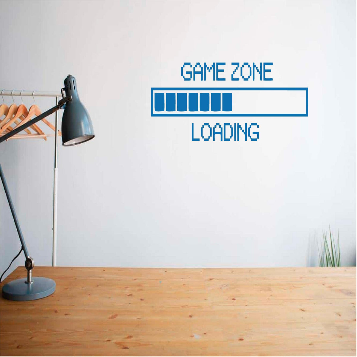 Blue Game Zone Loading wall decal above a wooden desk