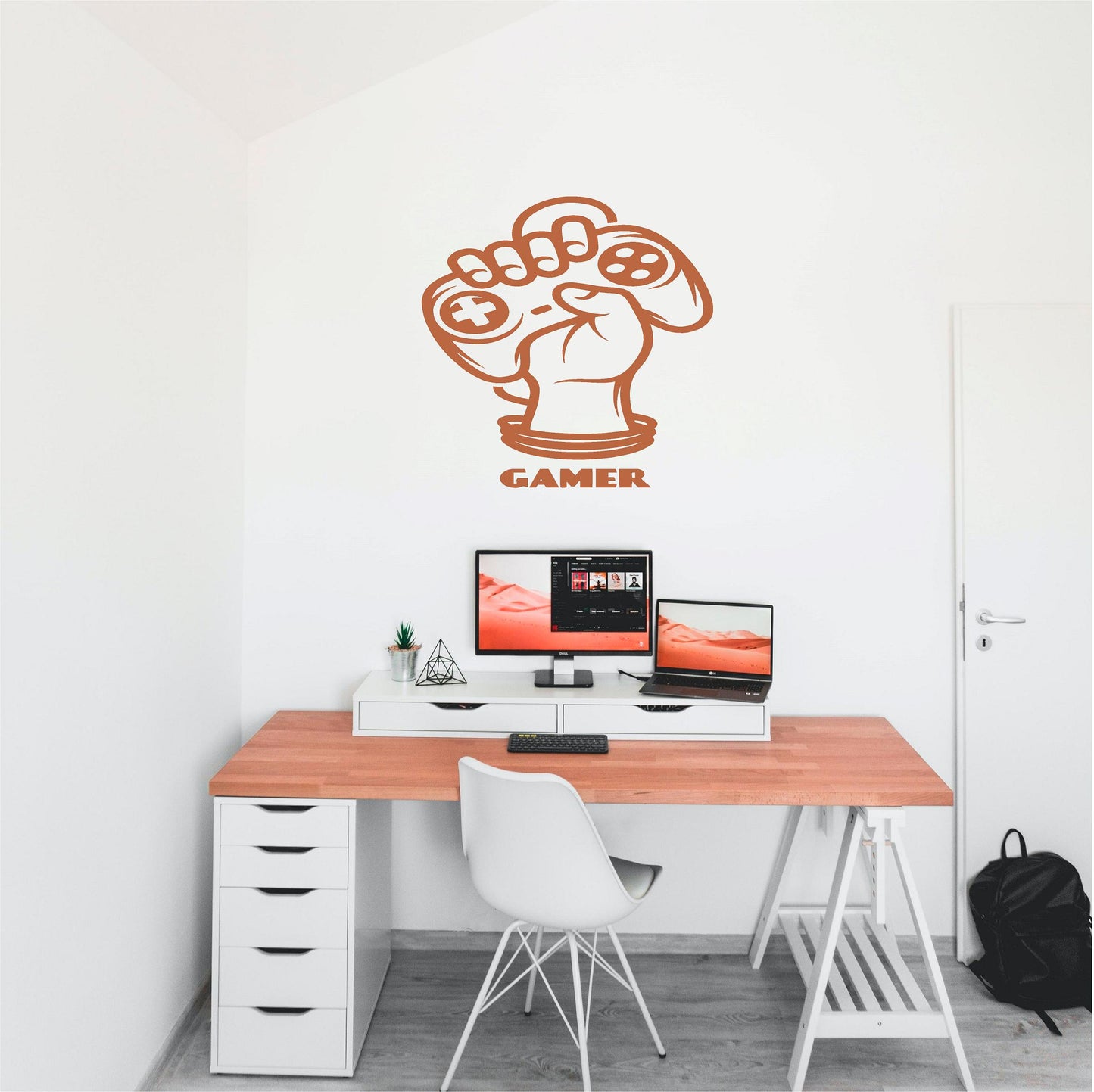 Orange Gamer Fist wall decal above a computer desk