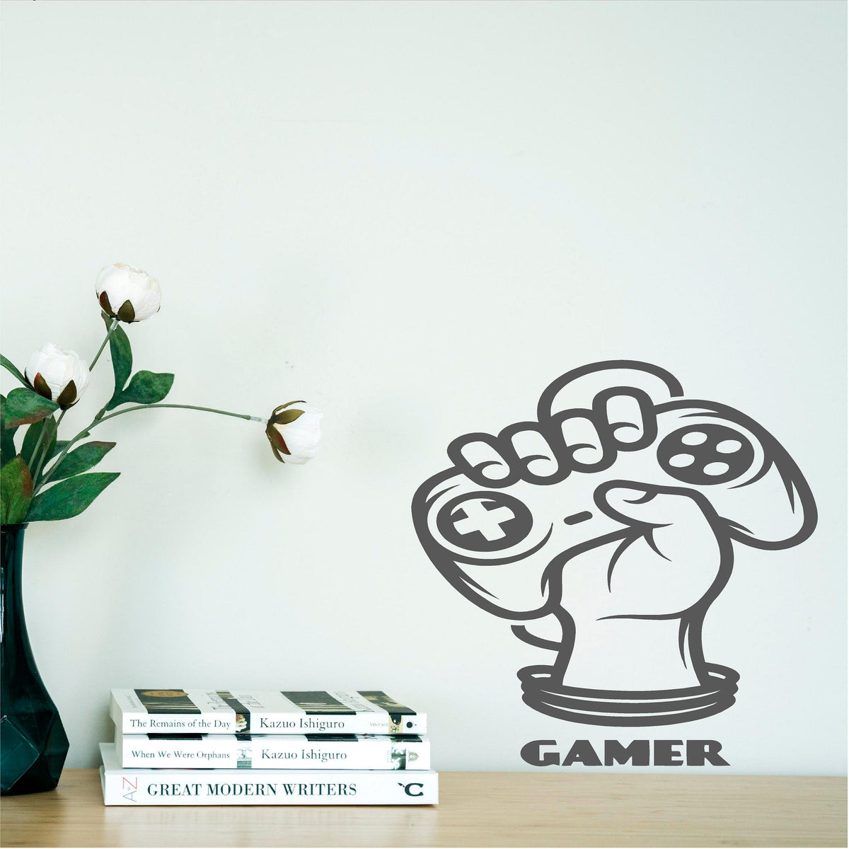 Grey Gamer Fist wall decal beside books and flowers