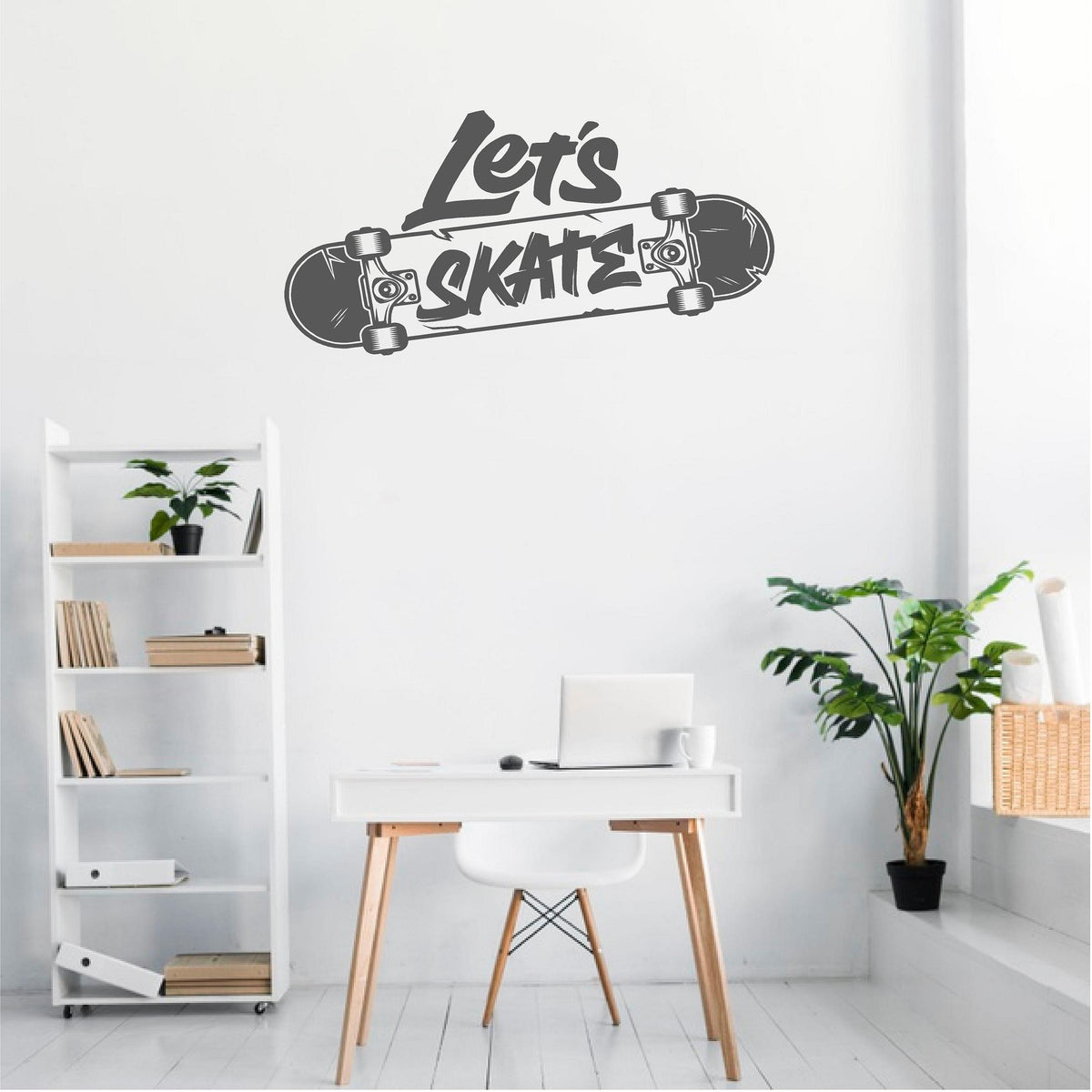 Grey Let's Skate wall decal above a white desk