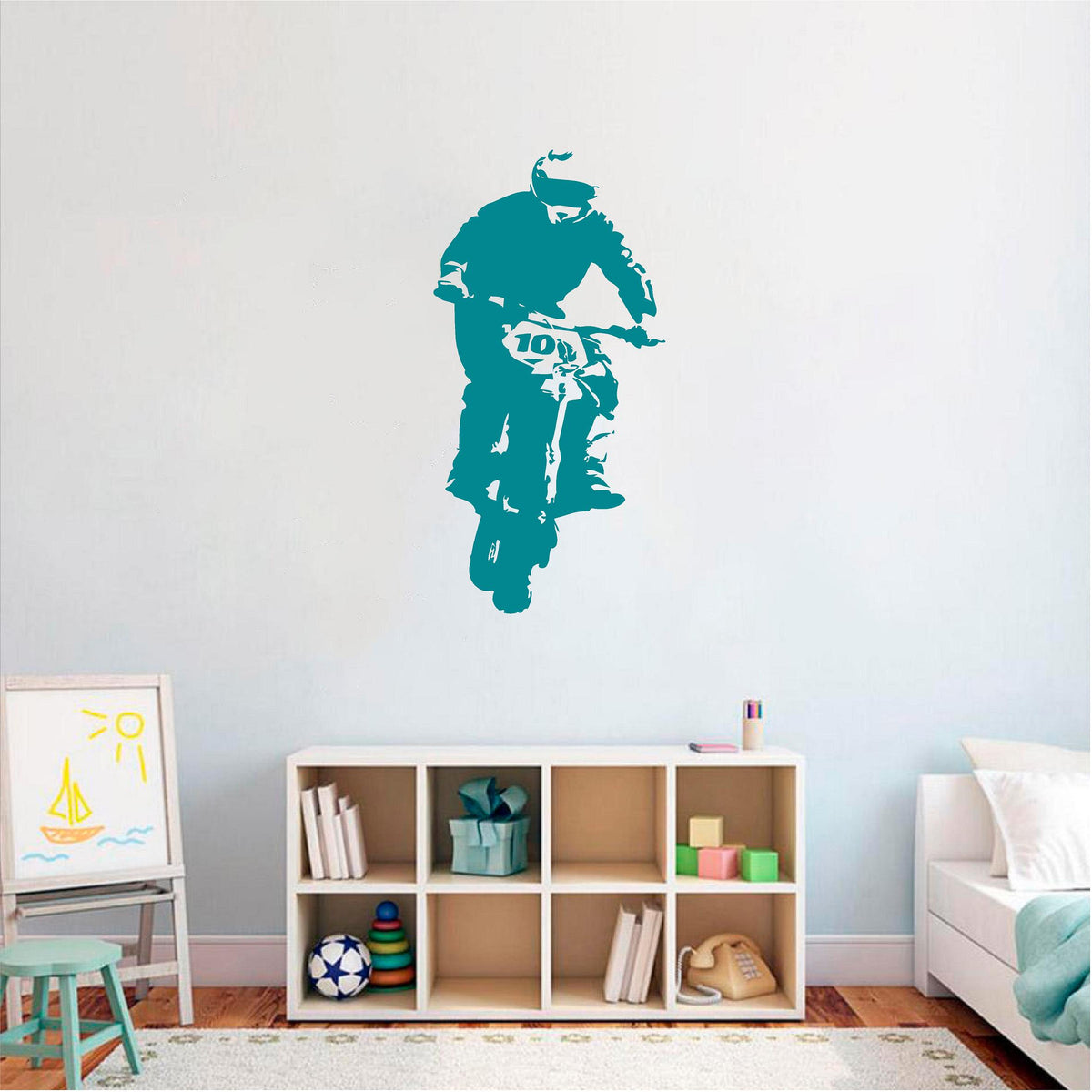 Teal rally biker wall decal above a bedroom storage unit