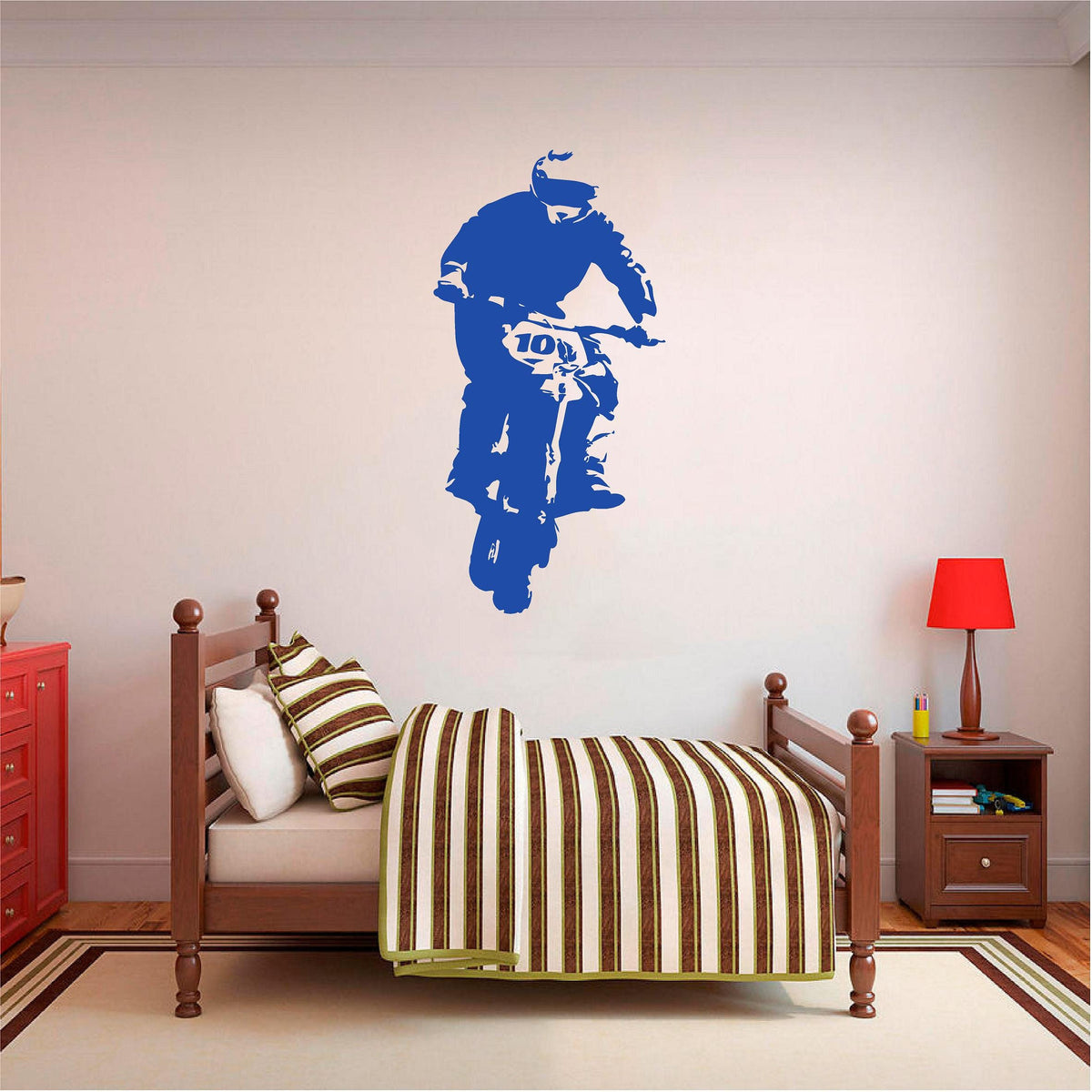 Blue rally biker wall decal above a single bed