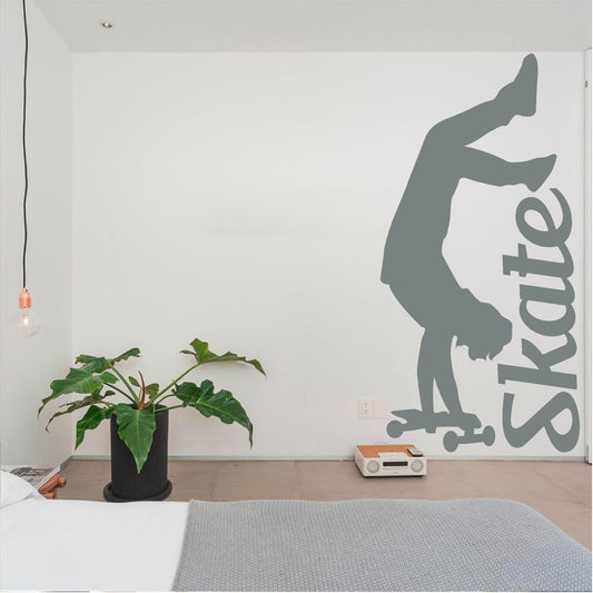 Grey handstand skater and Skate lettering wall decal in a bedroom