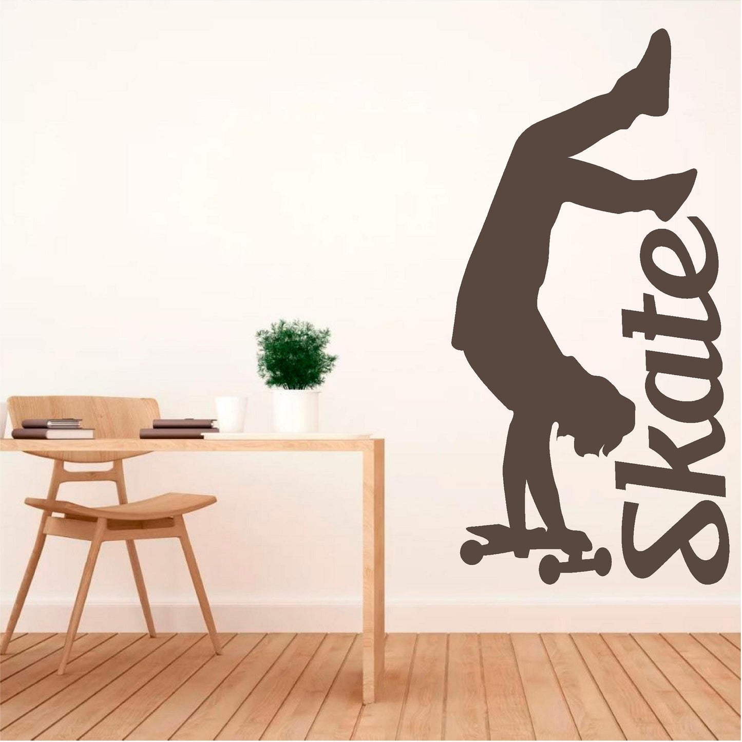 Brown handstand skater wall decal beside a wooden desk
