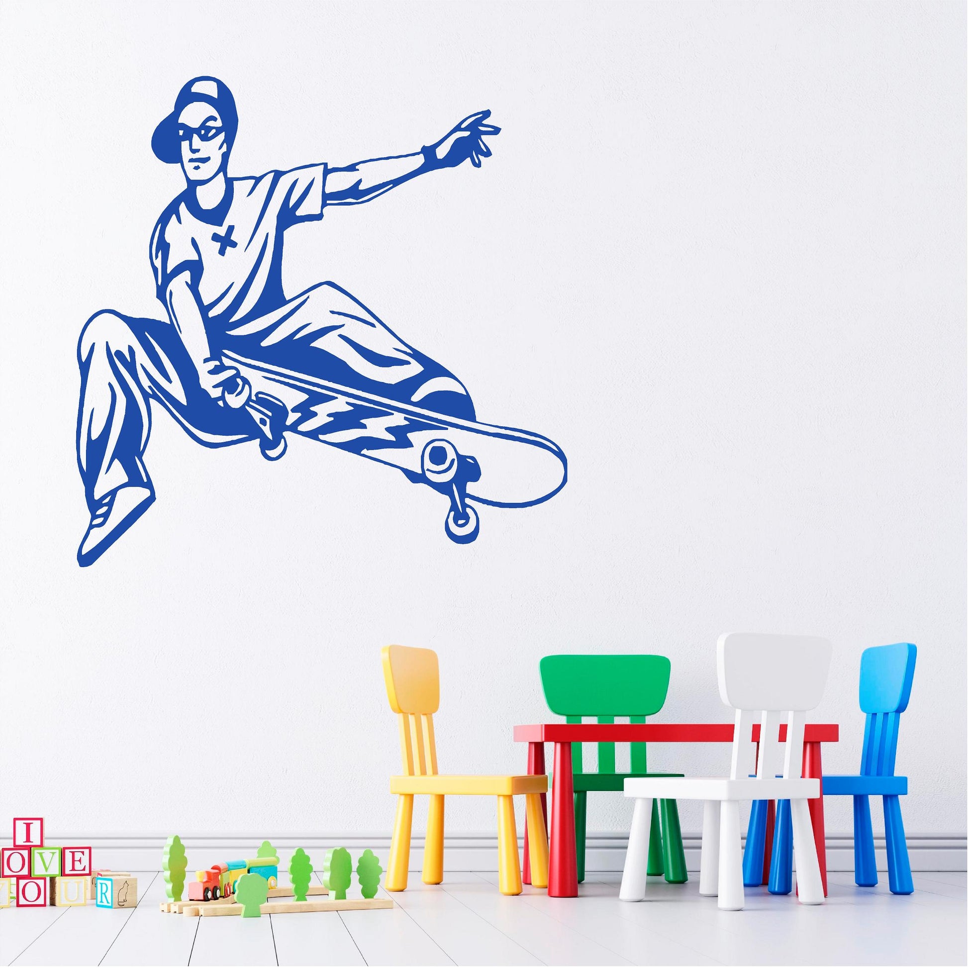 Blue skateboarder performing a board grab wall decal above colourful chairs