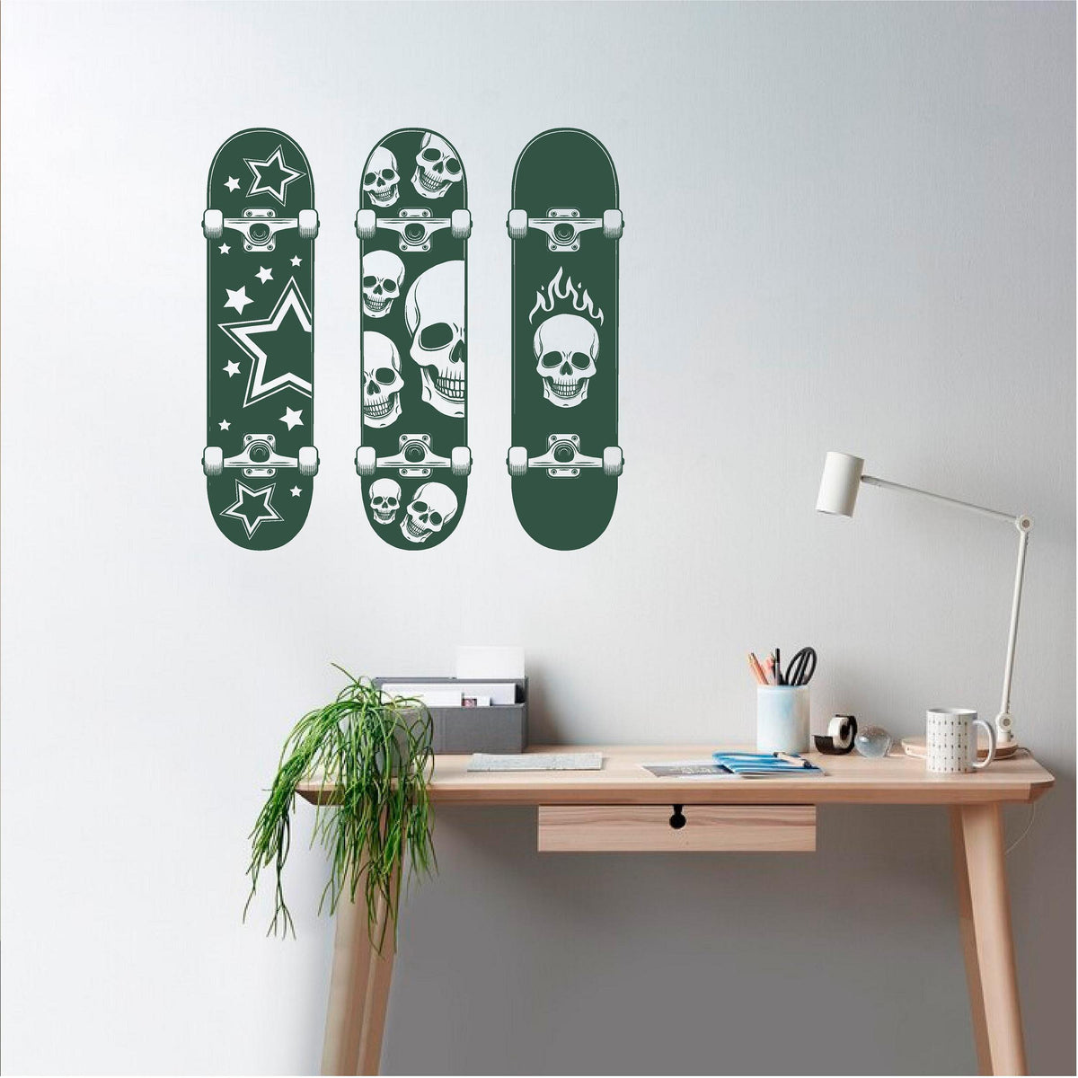 Dark green skateboard wall decal set above a wooden desk