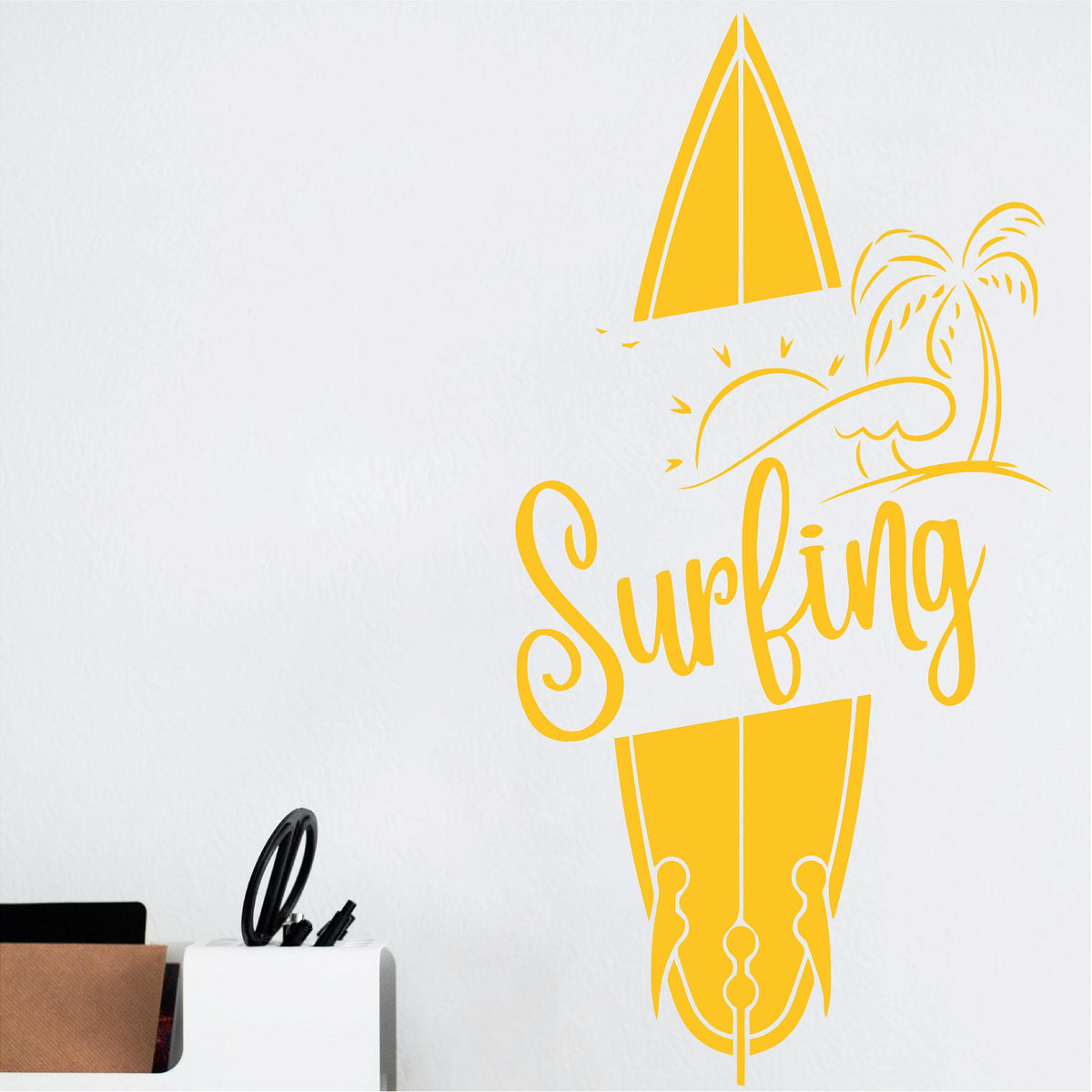 Yellow Surfing wall decal shown close up beside a desk