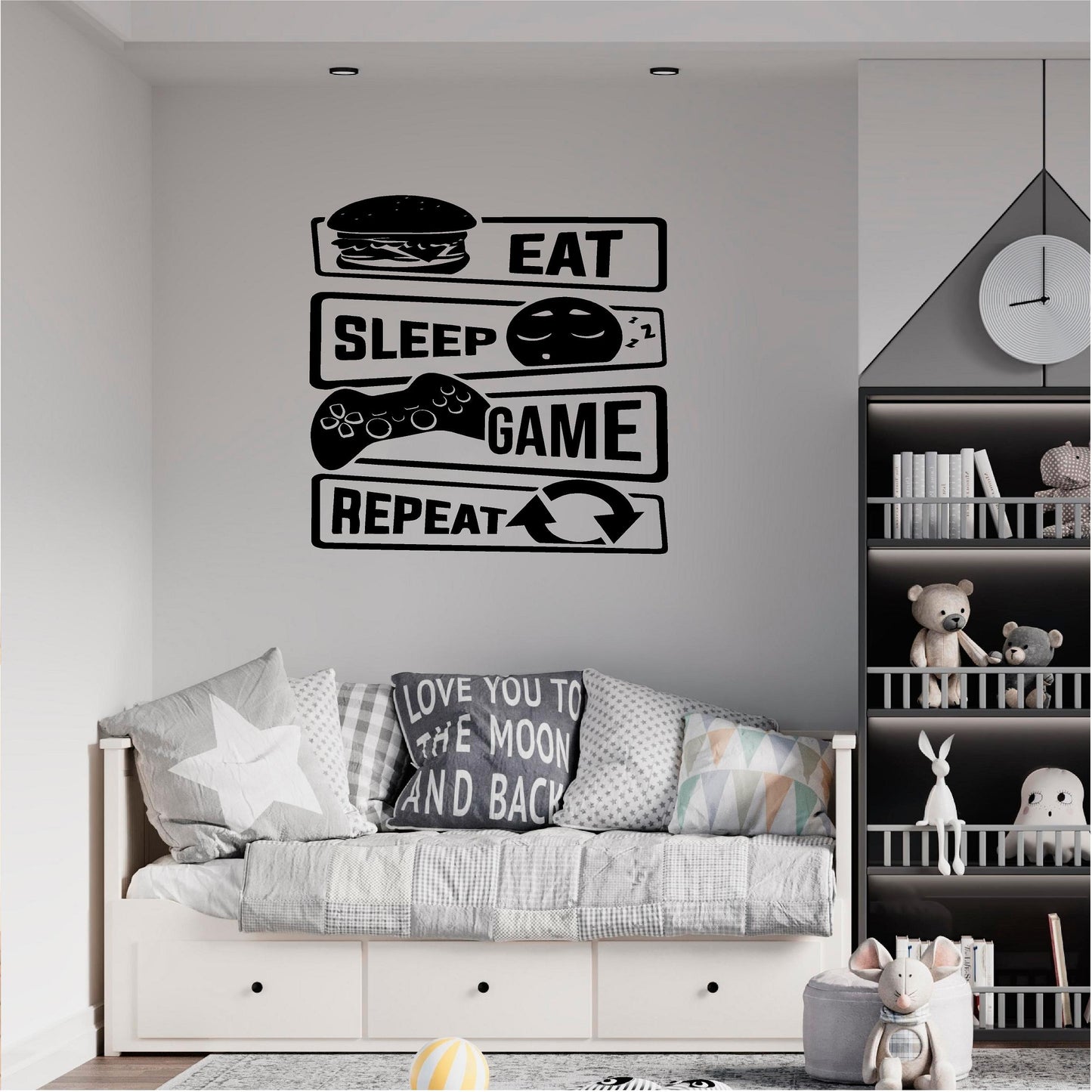 Black Eat Sleep Game Repeat wall decal above a grey bed