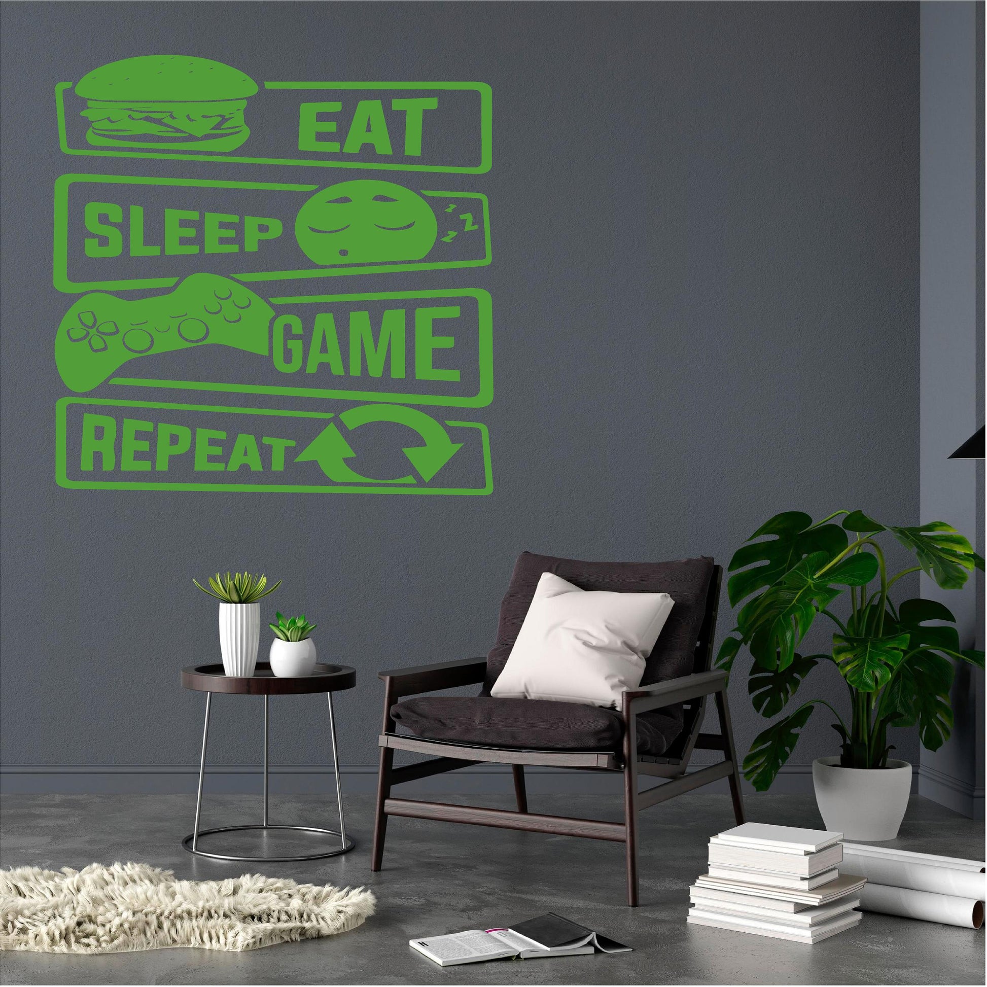 Green Eat Sleep Game Repeat wall decal beside a lounge chair