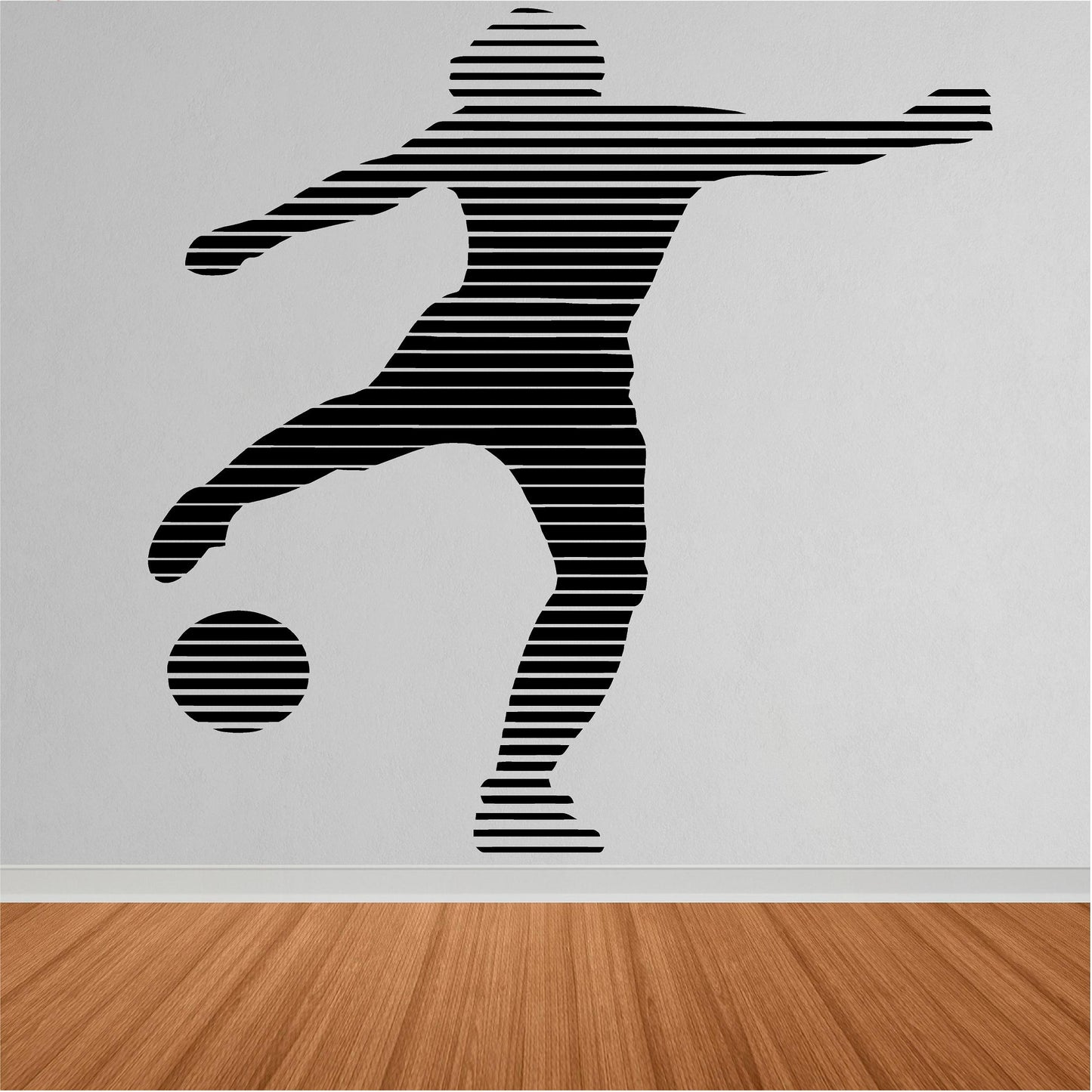 Black striped footballer and ball wall decal shown close up