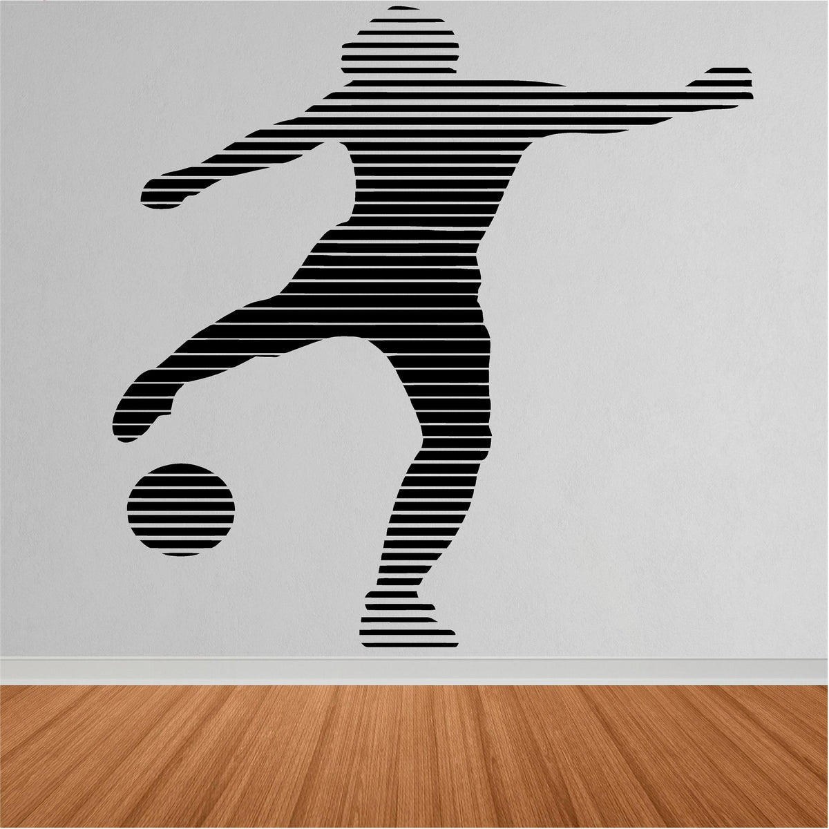 Black striped footballer and ball wall decal shown close up