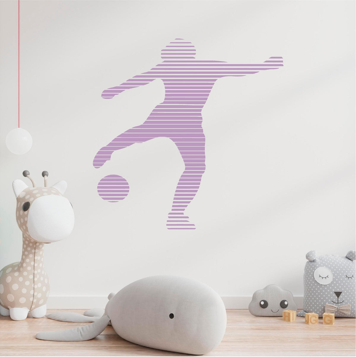 Lilac striped footballer wall decal in a nursery