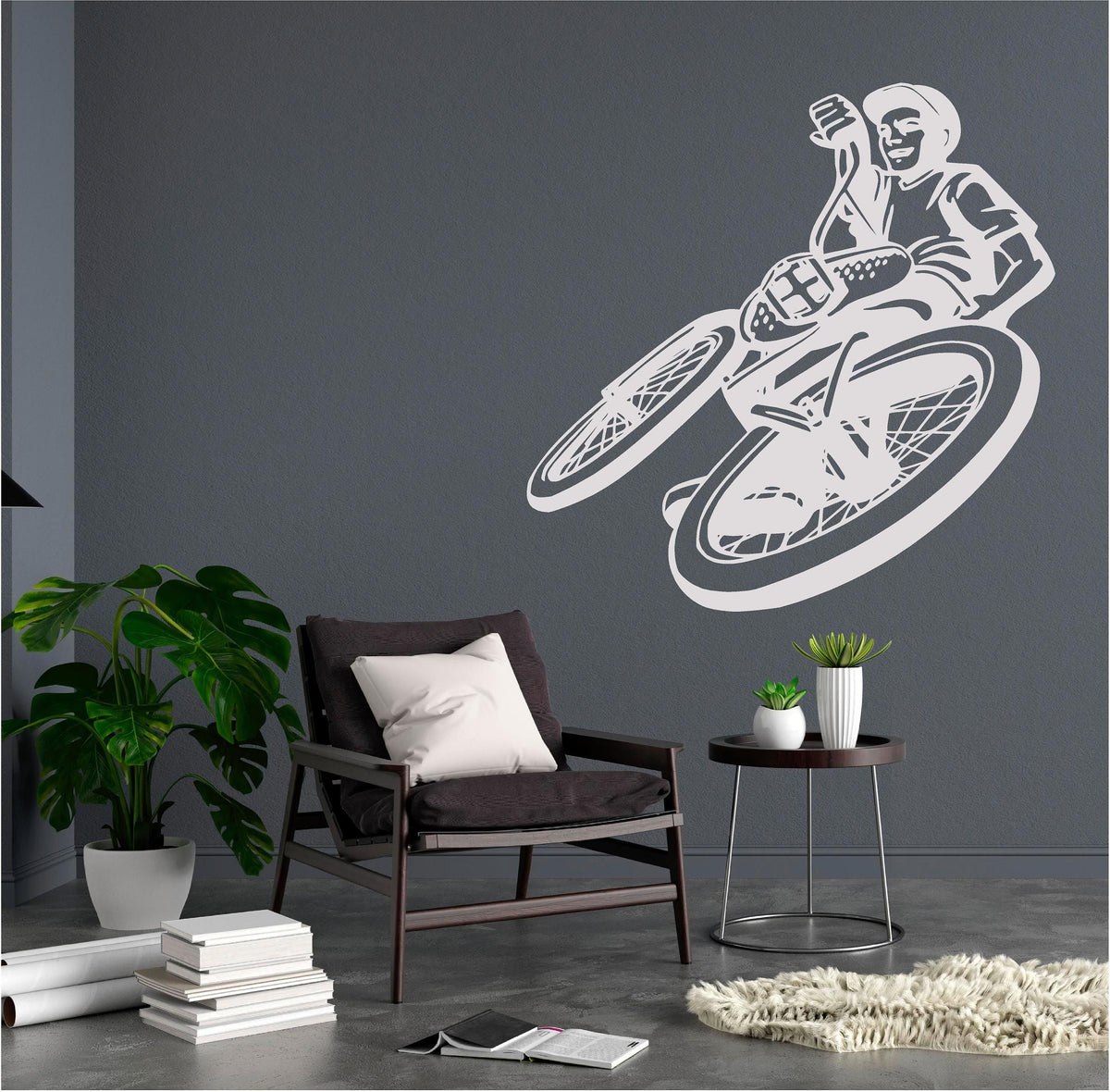 White BMX rider wall decal beside a lounge chair