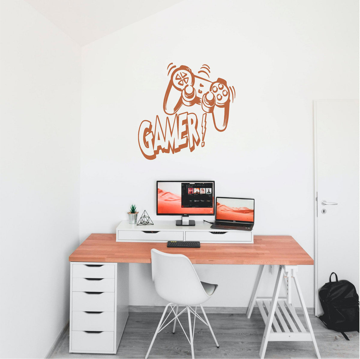 Copper-coloured Gamer controller wall decal above a computer desk