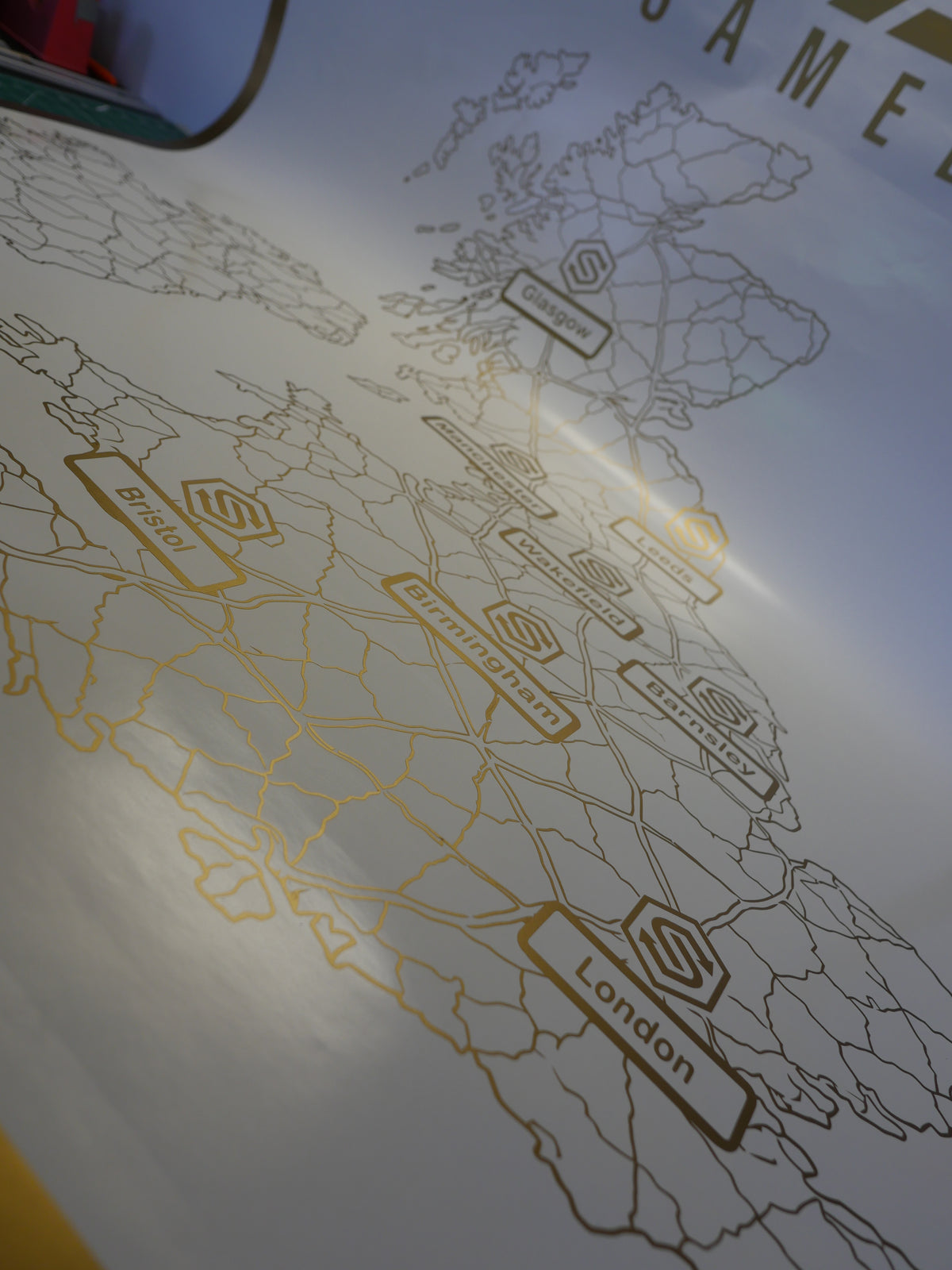 Gold UK locations map — prepared vinyl lettering or artwork, workshop photograph