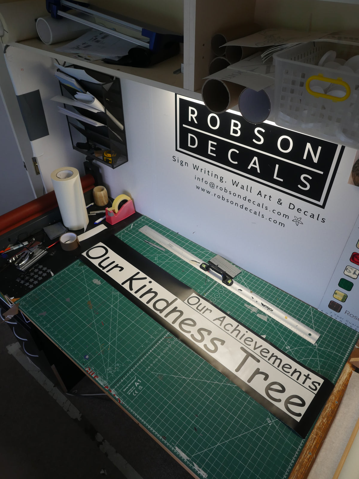 Kindness Tree and Achievements lettering - workshop — prepared vinyl lettering or artwork, workshop photograph