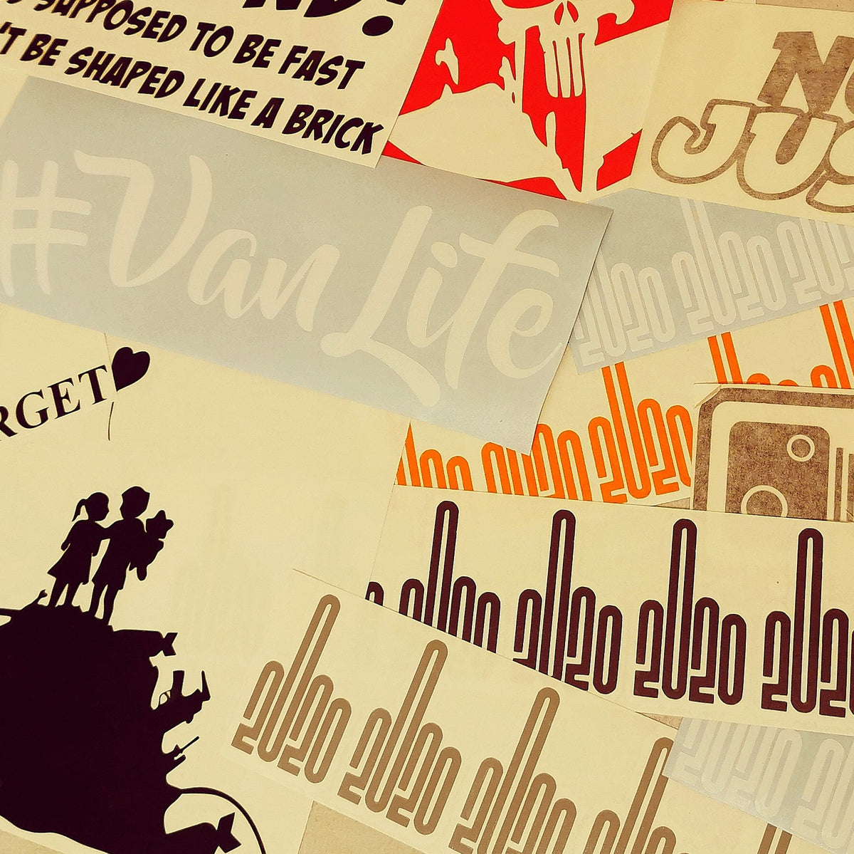 Mixed decal sheets — prepared vinyl lettering or artwork, workshop photograph