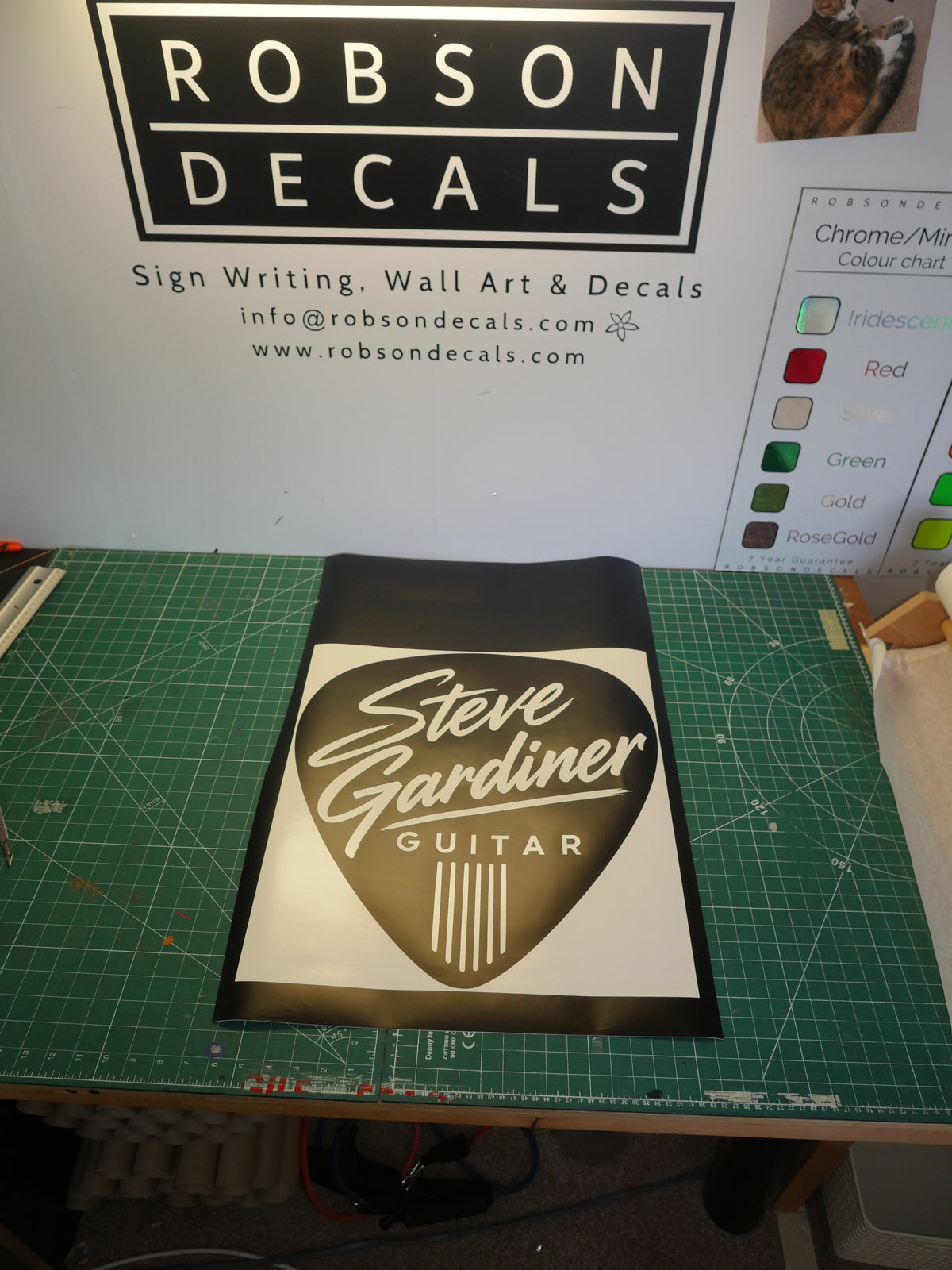 Steve Gardiner Guitar logo — prepared vinyl lettering or artwork, workshop photograph