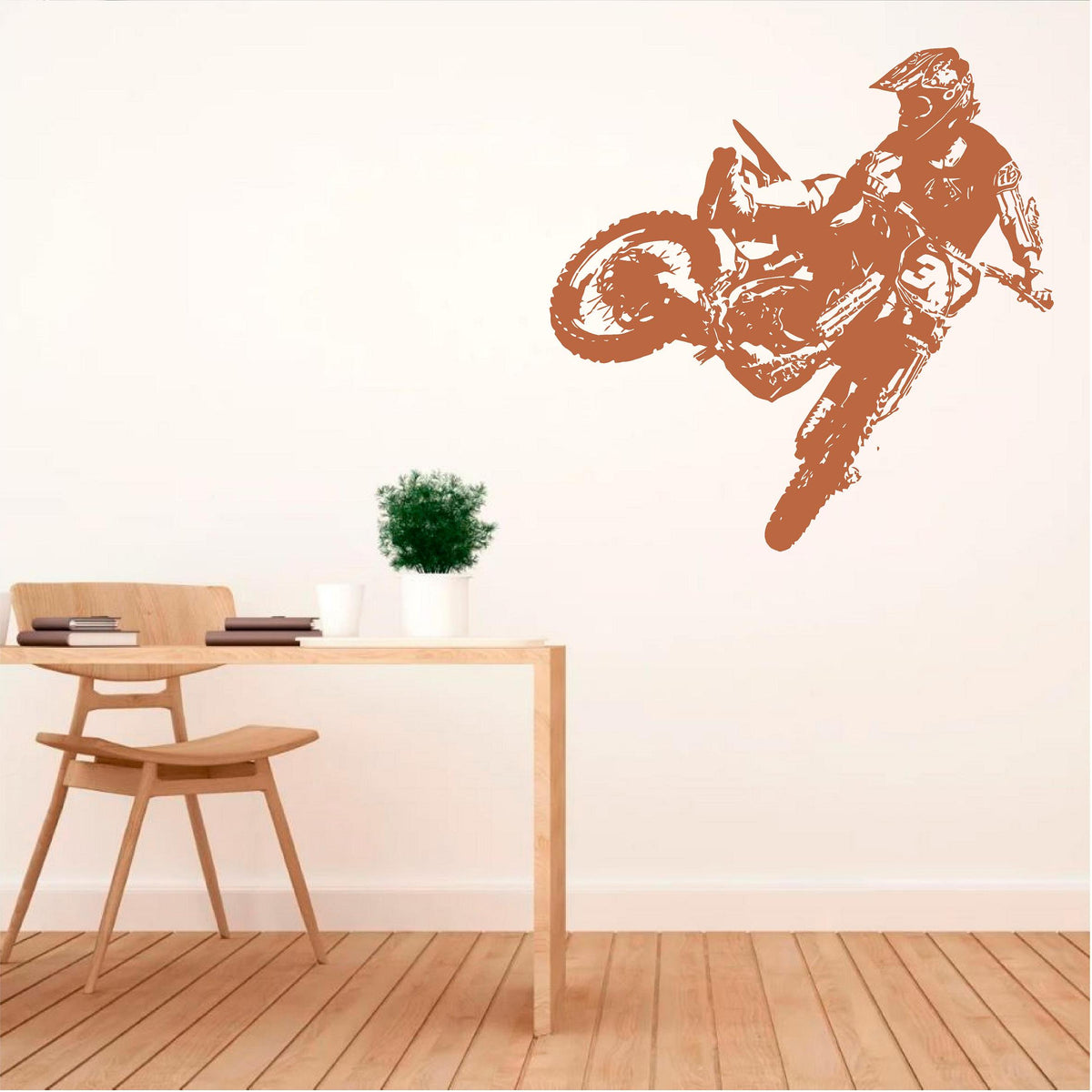 Warm brown motocross rider wall decal beside a desk