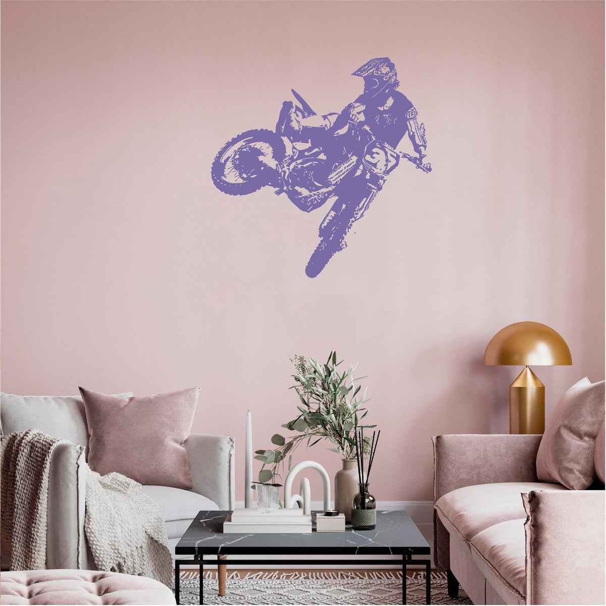 Purple motocross rider wall decal on a pink living room wall