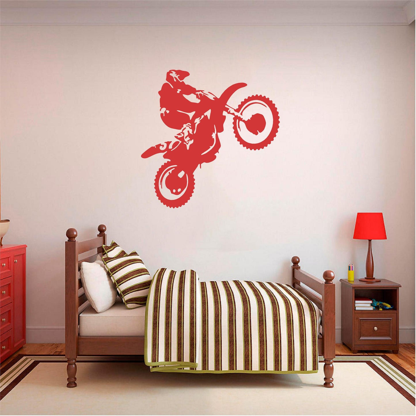 Red motorbike wheelie rider wall decal above a wooden single bed.