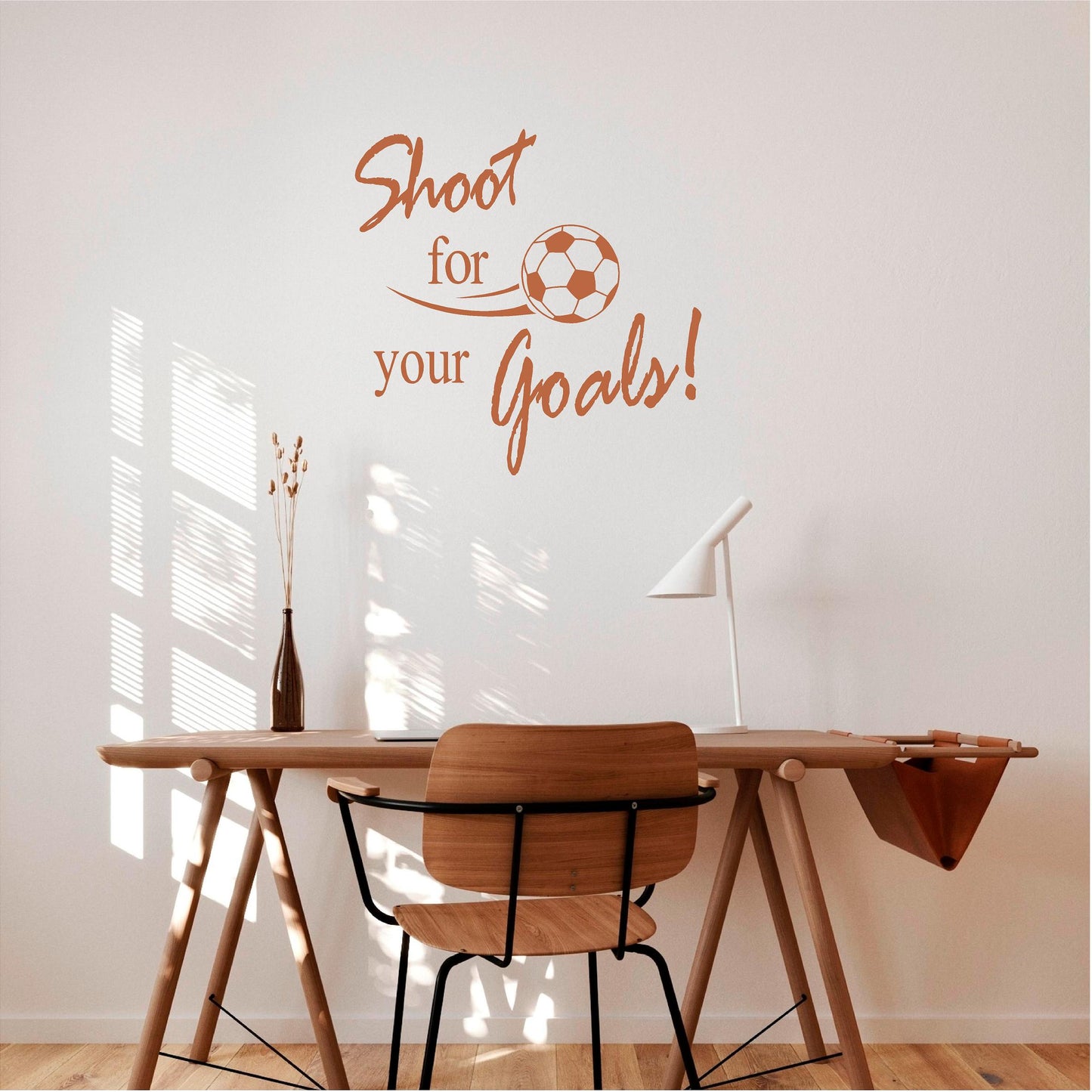 Warm brown Shoot for your Goals football wall decal above a desk