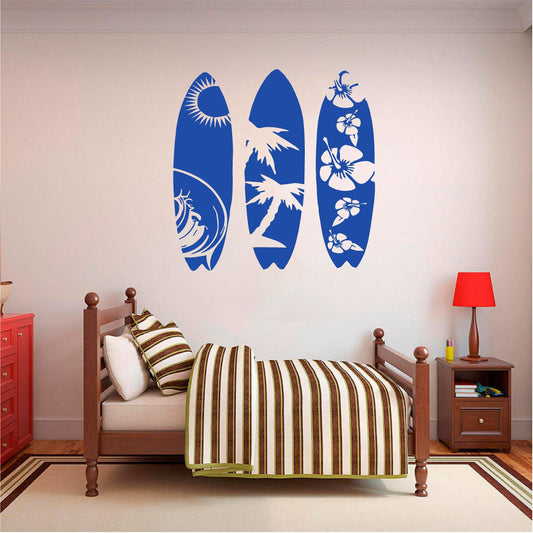 Blue tropical surfboard wall decal set above a wooden bed