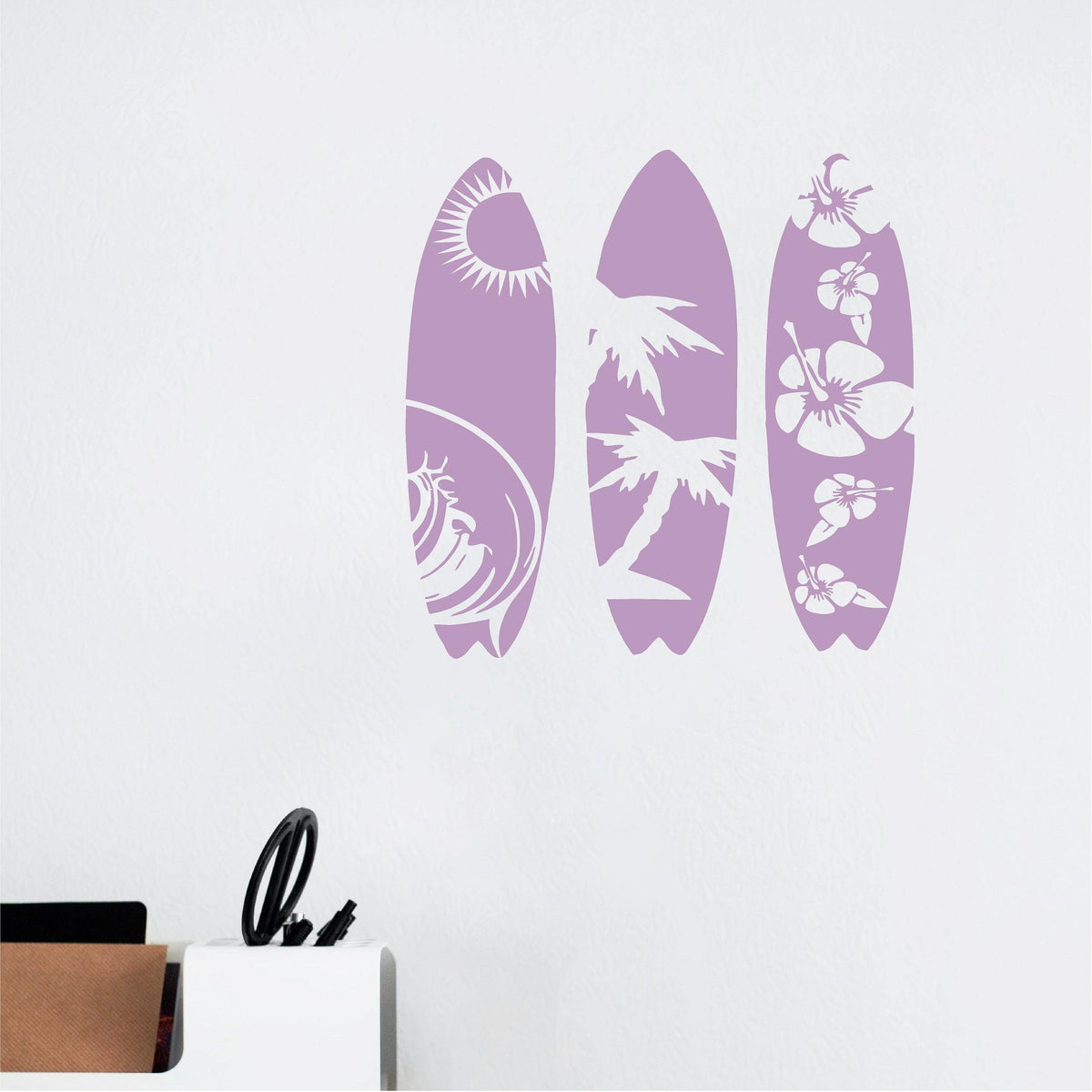Pale purple tropical surfboard wall decal set on a white wall